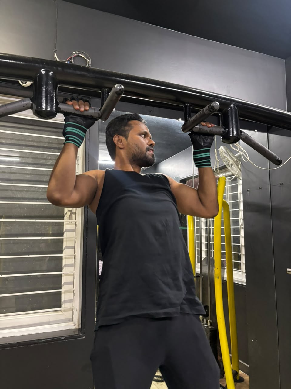 Member practising a pull-up on IMFIT’s third floor